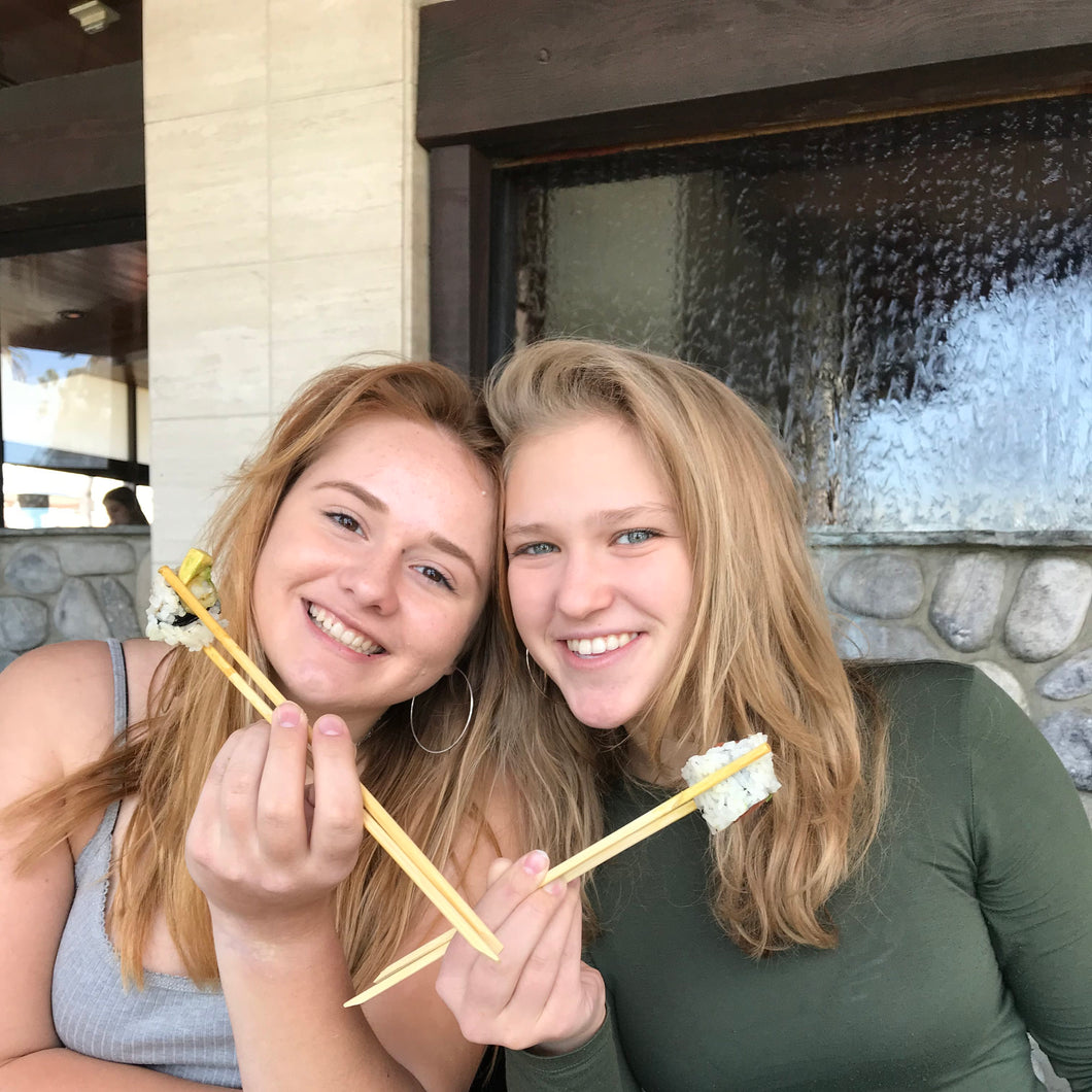 Niki and Becca Celebrating with Sushi